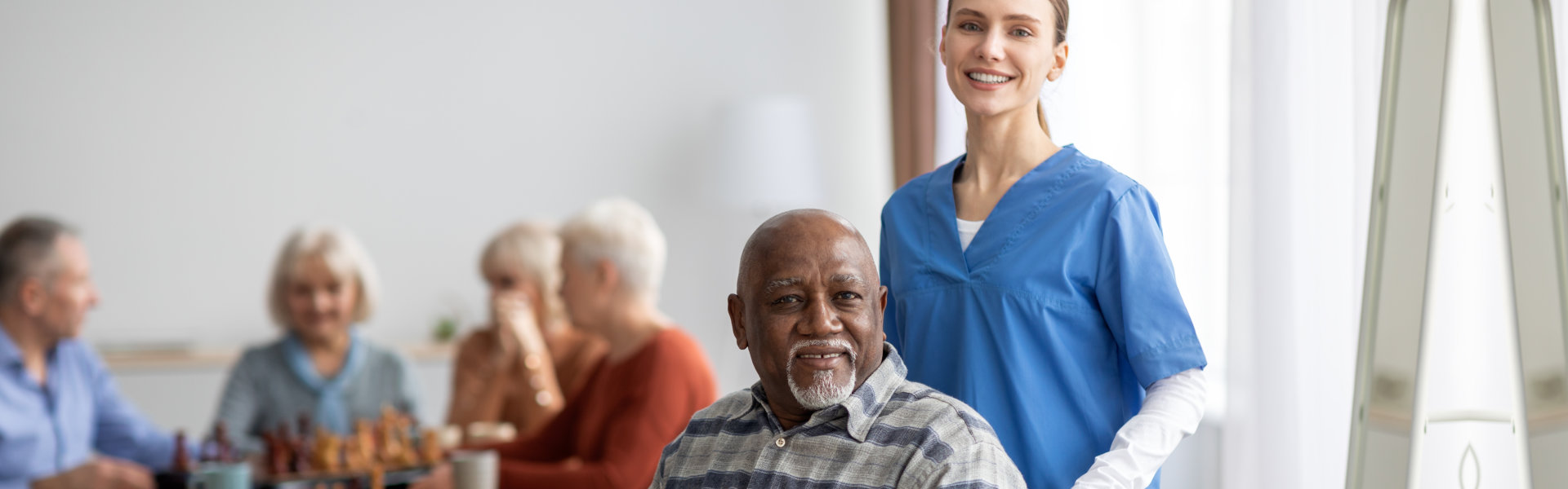 caregiver with senior man on wheelchair